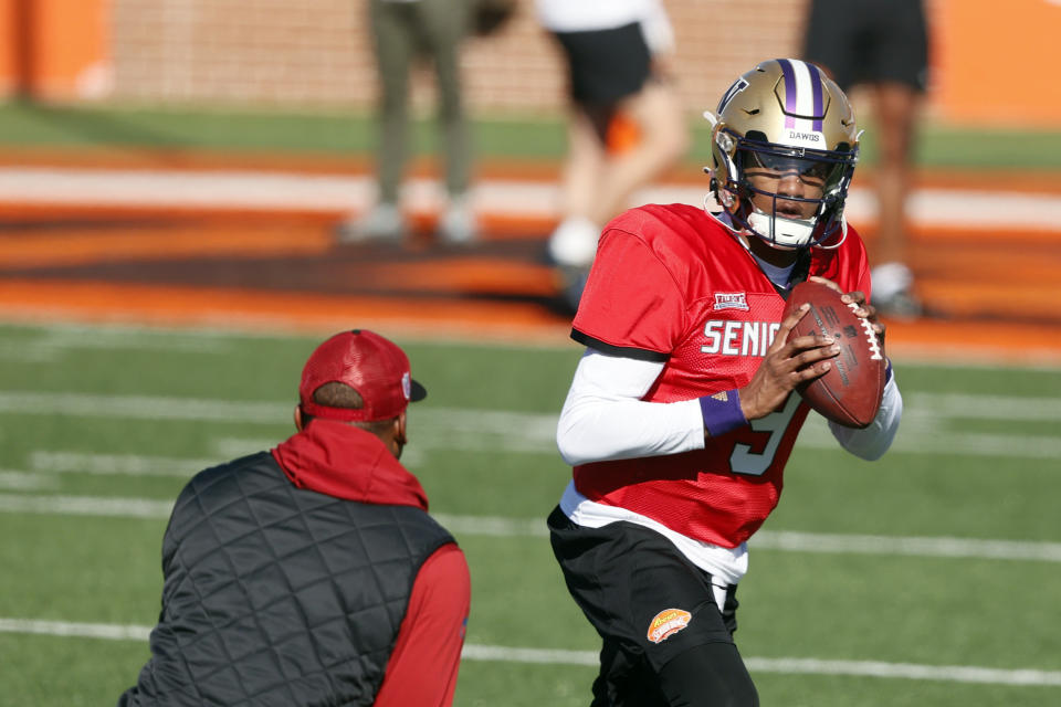 National quarterback Michael Penix Jr., of Washington, runs drills during practice for the Senior Bowl NCAA college football game, Tuesday, Jan. 30, 2024, in Mobile, Ala. (AP Photo/ Butch Dill)