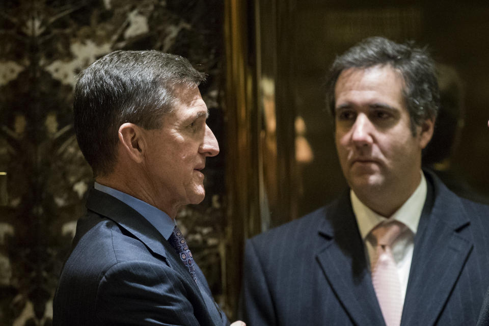 Michael Cohen, right, with former national security adviser Michael Flynn in the Trump Tower lobby after Trump's 2016 election. Both have since pleaded guilty to crimes related to the Trump campaign. (Photo: Drew Angerer via Getty Images)