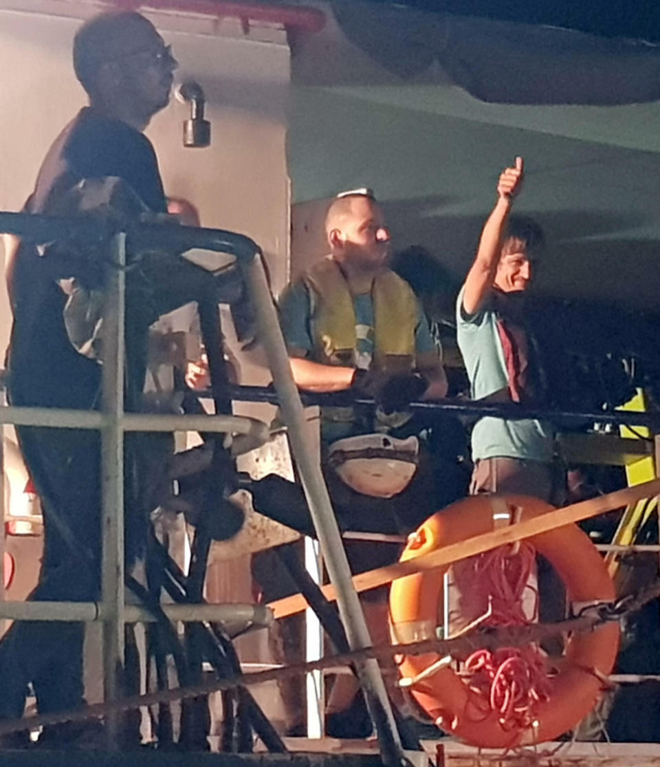 The Dutch-flagged Sea Watch 3 ship docks at Lampedusa island's harbor, Italy, early Saturday, June 29, 2019. Forty migrants have disembarked on a tiny Italian island after the captain of the German aid ship which rescued them docked without permission. Sea-Watch 3 rammed an Italian border police motorboat as it steered toward the pier on Lampedusa. Italian Interior Minister branded the captain, who was taken into custody, as an "outlaw" who put the lives of the police at risk. (Elio Desiderio/ANSA via AP)