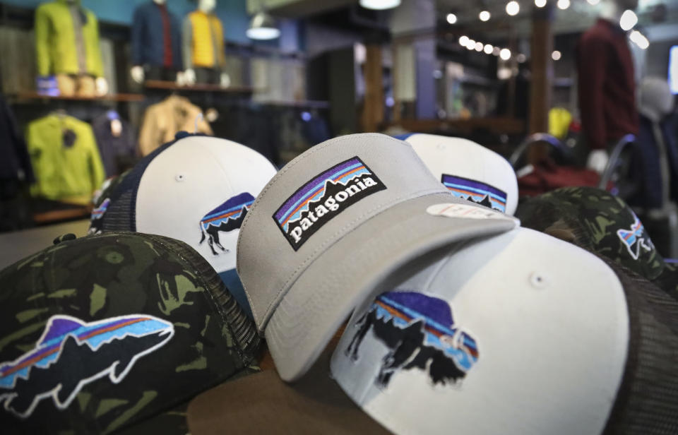 This photo shows the Patagonia logo on items in the brand section of a retail department store Wednesday, Nov. 28, 2018, in New York. Patagonia, an outdoor gear company, is passing along the $10 million it saved from tax cuts to non-profit environmental groups. (AP Photo/Bebeto Matthews)