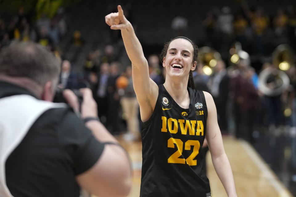 Iowa's Caitlin Clark celebrates after an NCAA Women's Final Four semifinals basketball game against South CarolinaFriday, March 31, 2023, in Dallas. Iowa won 77-73 to advance to the championship on Sunday. (AP Photo/Darron Cummings)