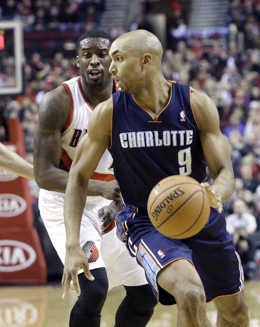 Charlotte Bobcats guard Gerald Henderson, right, drives past Portland Trails Blazers guard Wesley Matthews during the first half of an NBA basketball game in Portland, Ore., Thursday, Jan. 2, 2014. (AP Photo/Don Ryan)