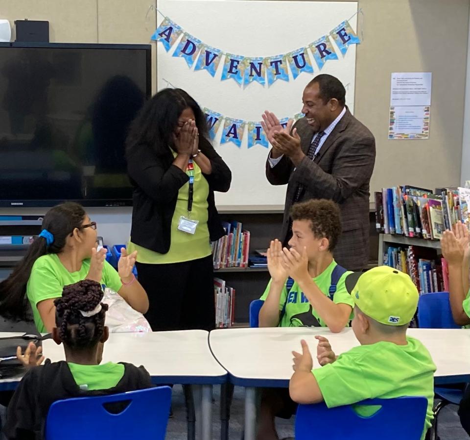 Samoset fourth-grade teacher Deelah Jackson reacts to news from Deputy Chancellor for Educator Quality Paul Burns that she has been named a finalist for Teacher of the Year in the state of Florida.