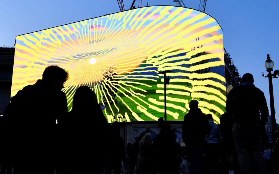 Ocean Outdoor last month it broadcast an animated sunrise across the Piccadilly Lights by the artist David Hockney - TOBY MELVILLE/REUTERS