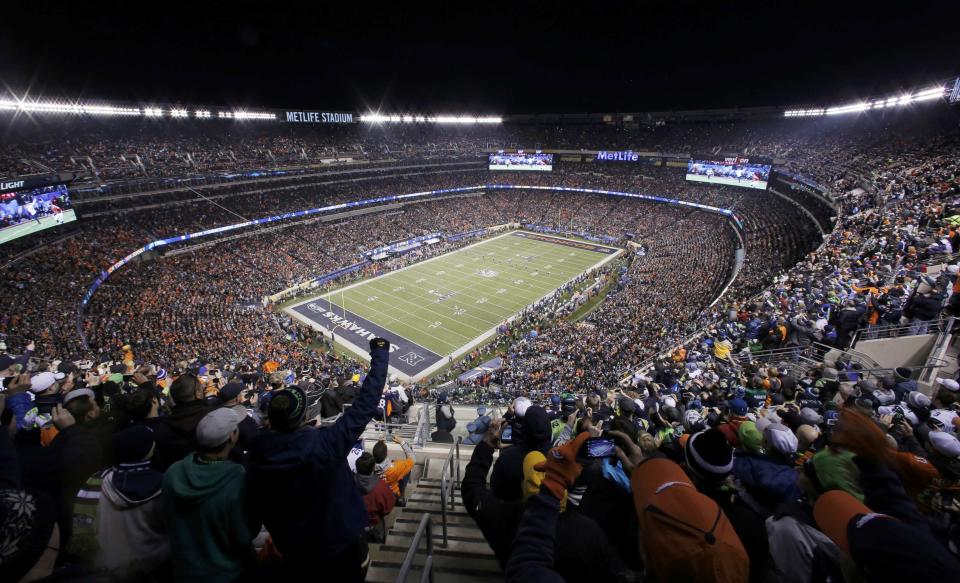 Fans cheer during the first quarter as the Broncos play the Seahawks in the NFL Super Bowl XLVIII football game in East Rutherford