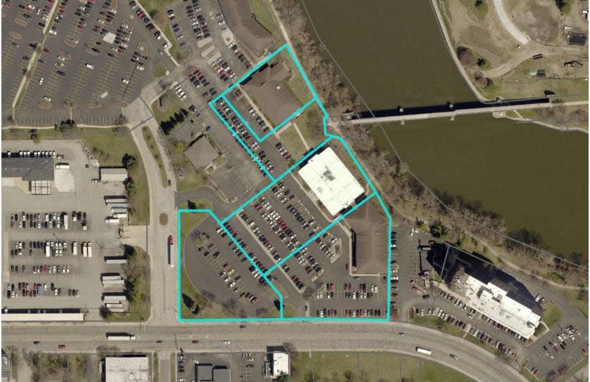 The city of South Bend on Thursday bought 5.2 acres of office buildings and parking lots, outlined in blue, near the post office downtown. City officials plan to rebuild a grid street network and are seeking proposals for mixed-use redevelopment.