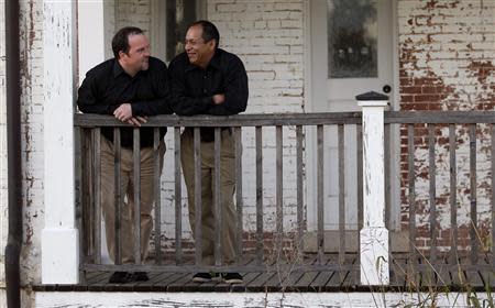 Darren Black Bear (R) and Jason Pickel wait for their photographer before being married by Darren's father Rev. Floyd Black Bear in El Reno, Oklahoma October 31, 2013. REUTERS/Rick Wilking