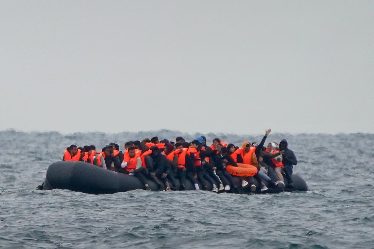 A group of people thought to be migrants crossing the Channel in a small boat (PA Archive)