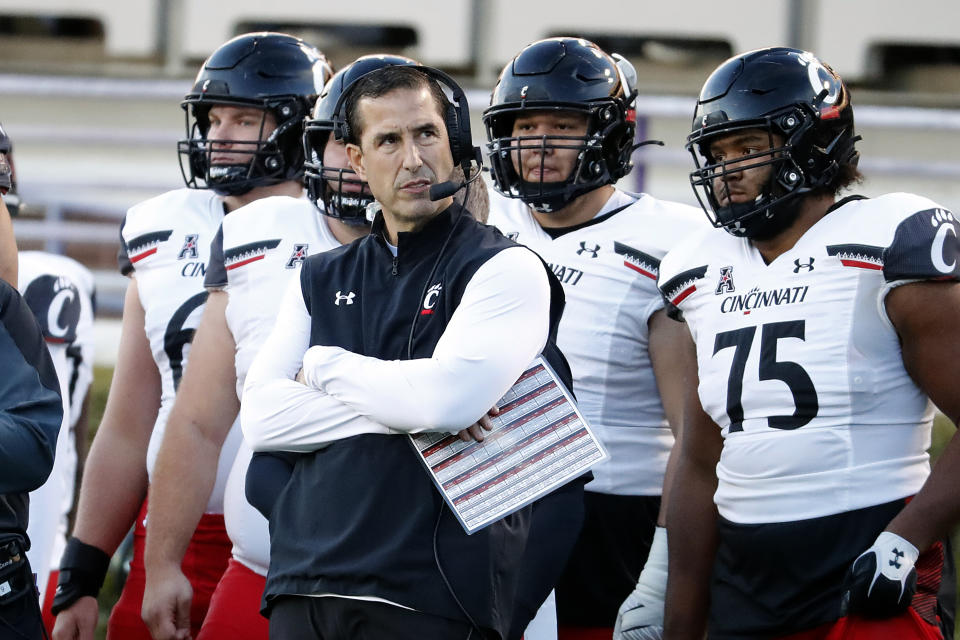 Cincinnati head coach Luke Fickell watches from the sidelines during the first half of an NCAA college football game against East Carolina in Greenville, N.C., Friday, Nov. 26, 2021. (AP Photo/Karl B DeBlaker)