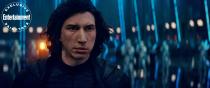 A scarred First Order Supeme Leader Kylo Ren (<a href="https://ew.com/tag/adam-driver/" rel="nofollow noopener" target="_blank" data-ylk="slk:Adam Driver;elm:context_link;itc:0;sec:content-canvas" class="link ">Adam Driver</a>) with an array of stromtroopers.