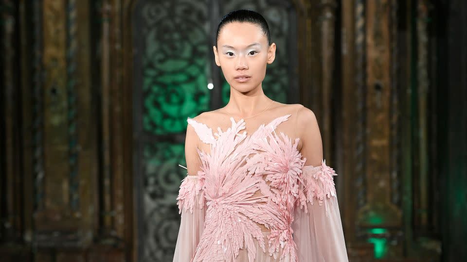 Kahn’s second collection included intricate gowns inspired by the film adaptation of “Wicked” in the musical’s famed color scheme of pink and green. - Fernanda Calfat/Getty Images