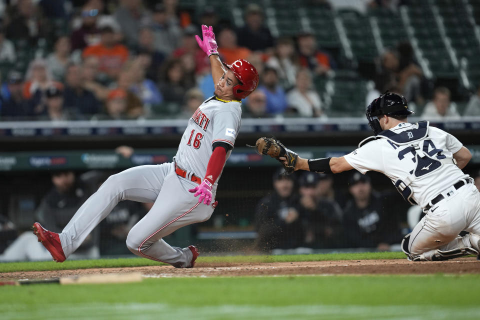 Cincinnati Reds' Noelvi Marte (16) slides into home plate safely past the tag of Detroit Tigers catcher Jake Rogers (34) in the 10th inning of a baseball game, Tuesday, Sept. 12, 2023, in Detroit. (AP Photo/Paul Sancya)