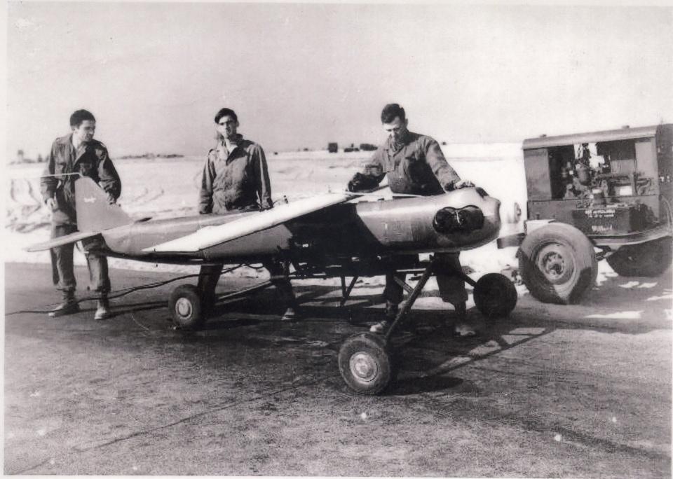 This National Park Service archive photo shows military personnel at Camp Wellfleet standing with a Remote Control Aerial Target (RCAT) drone plane.