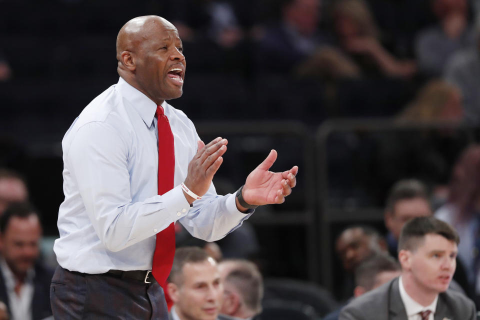 St. John's coach Mike Anderson applauds his team during the second half of the team's NCAA college basketball game against Georgetown in the first round of the Big East men's tournament Wednesday, March 11, 2020, in New York. (AP Photo/Kathy Willens)