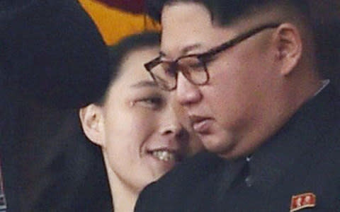 In this May 10, 2016, photo, North Korean leader Kim Jong-un and his sister Kim Yo-jong watch a military parade - Credit: AP
