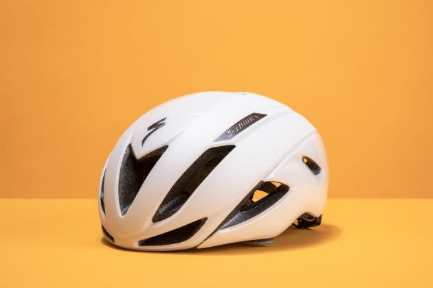 Specialized Evade helmet is shown front side on on an orange background