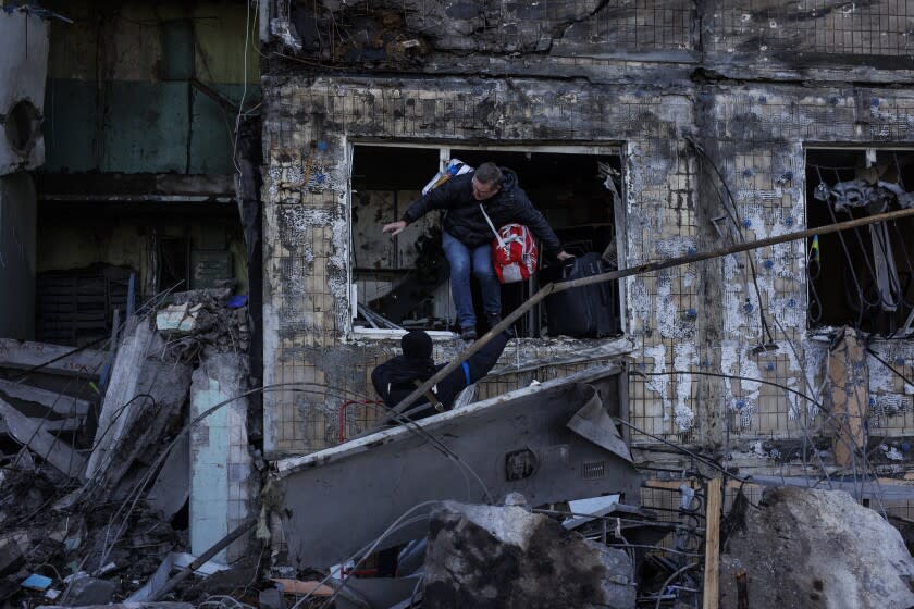 KYIV, UKRAINE - MARCH 14: Destruction after an apartment building hit by Russian attack in Kyiv, Ukraine on March 14, 2022. At least two civilians were killed as Russian forces targeted an apartment in the capital Kyiv, the country's State Emergency Service said on Monday. Artillery hit a nine-story apartment building in the Obolonsky district, northern Kyiv, at 05.09 a.m. local time (0309GMT), causing a fire in the building. (Photo by Alejandro Martinez/Anadolu Agency via Getty Images)