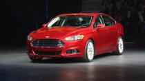 Later this year, Ford Motor Co. will launch this: the 2013 Ford Fusion midsize sedan in three variations — including a plug-in hybrid that gets 100 mpg, besting every other liquid-powered vehicle for sale to the American public. It could be a winning equation, but there's a few key variables Ford hasn't revealed. The current Fusion has turned into a mainstay of Ford's lineup, and the most popular car built by an American automaker, with sales hitting 248,067 in 2011. For its redesign, Ford will run the same play it's called on with the smaller Fiesta and Focus −- build one version of the Fusion for sale worldwide, using the Mondeo name in Europe and elsewhere, to lower costs while raising quality. Assembled in Mexico and Michigan, styled in Europe to follow the new Ford global look, two of its three engines will be built in Spain and England.