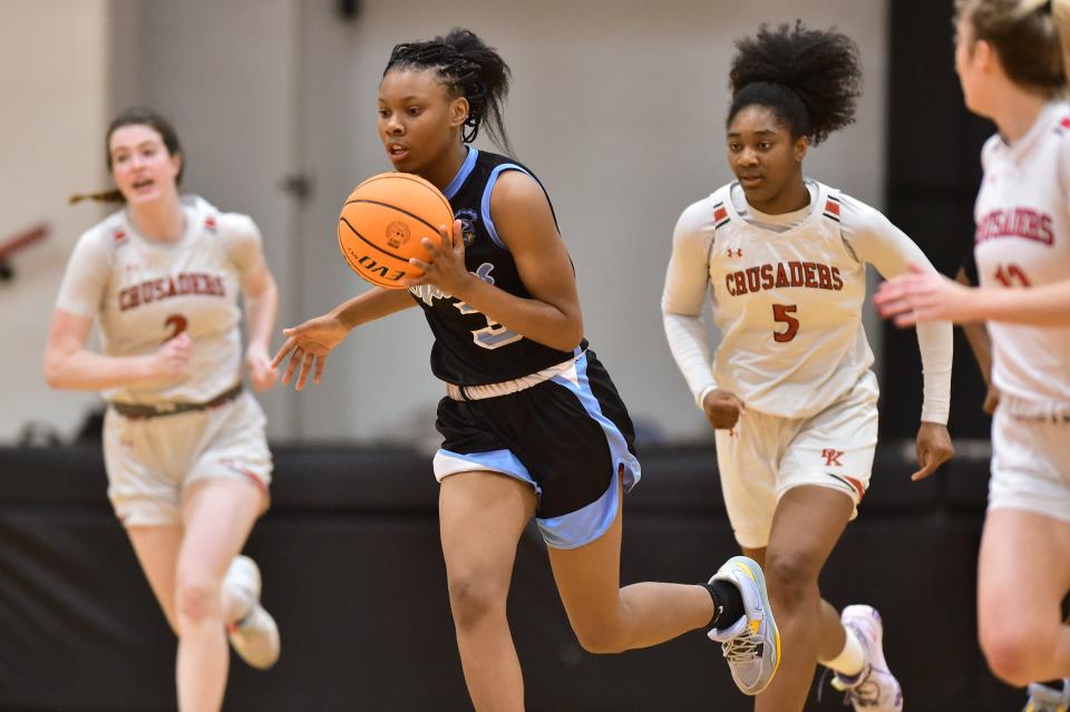 Ribault's Destiny Donaldson (3) dribbles up the court. The Trojans lead Northeast Florida in all-time state championships in girls basketball.