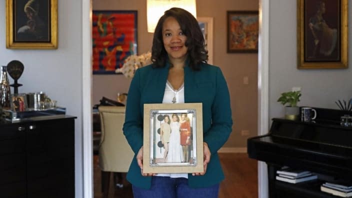 Robin Rue Simmons, alderwoman of Evanston’s 5th Ward, poses for a portrait holding a photograph of her mother, aunt, and grandmother in her home in Evanston, Illinois. The fourth-generation Black resident spearheaded the Evanston reparations effort after studying racial disparity data, which show the average income of Black families in Evanston is $46,000 less than that of white families. (Photo: Shafkat Anowar/AP)