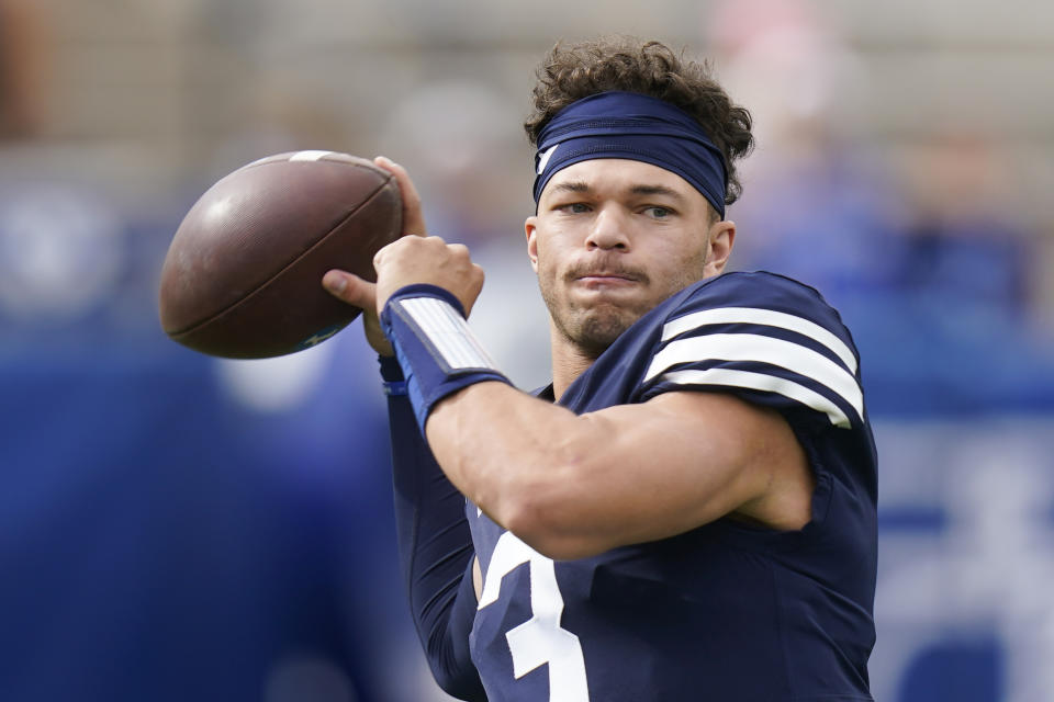 FILE - BYU quarterback Jaren Hall (3) warms up before the start of an NCAA college football game against Idaho State on Nov. 6, 2021, in Provo, Utah. Hall, a fifth-year junior, is the lynchpin, giving BYU a dynamic dual-threat presence that gave defenses fits. In 10 starts last season, Hall threw for 2,583 yards and 20 touchdowns while tossing only five interceptions. He completed 64% of his pass attempts. (AP Photo/Rick Bowmer, File)