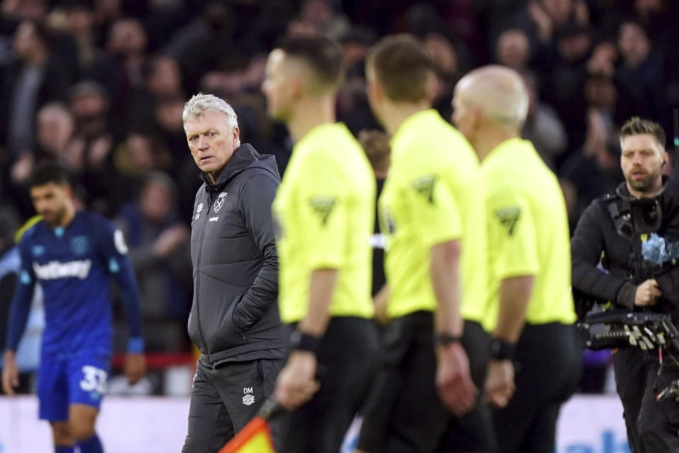 West Ham United manager David Moyes, second left, looks over to the referee officials after the final whistle of the English Premier League soccer match between Sheffield United and West Ham United at Bramall Lane, in Sheffield, England, Sunday, Jan. 21, 2024. (Mike Egerton/PA via AP)