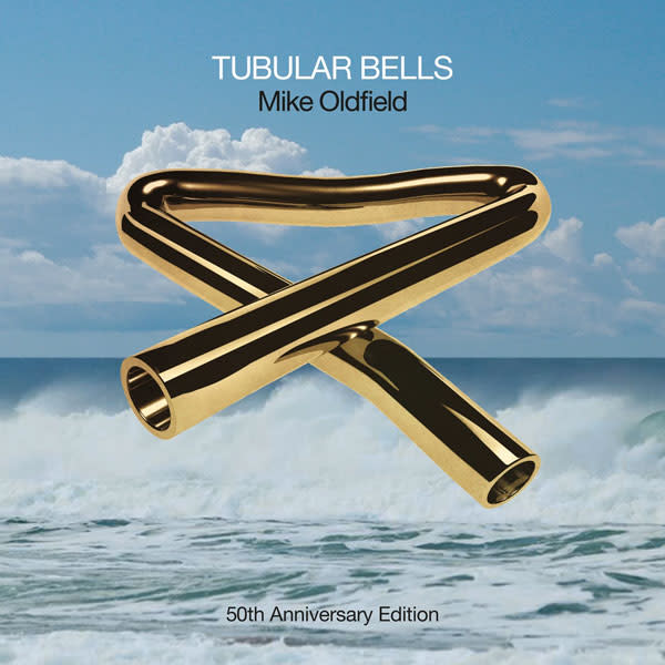 Album artwork for the 50th anniversary edition of Mike Oldfield's Tubular Bells displaying a gold tubular bell against the backdrop of the sea