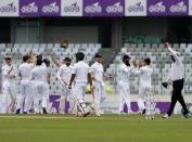 Cricket - Bangladesh v England - Second Test cricket match - Sher-e-Bangla Stadium, Dhaka, Bangladesh - 28/10/16. England's players celebrate the dismissal of Bangladesh's Imrul Kayes. REUTERS/Mohammad Ponir Hossain