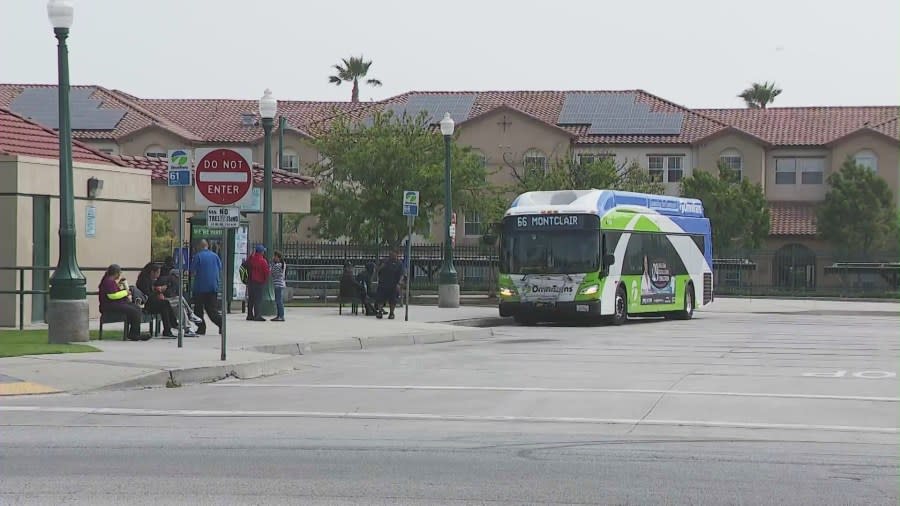 Riders waiting to board a metro bus in Fontana, California. (KTLA)