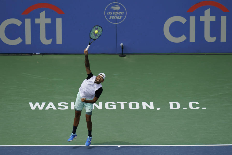 Nick Kyrgios, of Australia, serves during a match against Reilly Opelka, of the United States, at the Citi Open tennis tournament in Washington, Friday, Aug. 5, 2022. Kyrgios won the match that was postponed yesterday because of weather. (AP Photo/Carolyn Kaster)