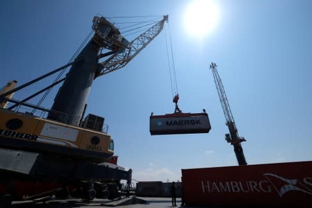 A ship transports empty containers at the seaport of Benghazi