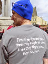 Ray Jensen Jr., assistant director of the United Auto Workers Region 9 office, shows his T-shirt during a rally in Trenton N.J., Friday, April 5, 2024, after the UAW and casino workers filed a lawsuit challenging New Jersey's clean indoor air law that exempts casino workers from its protections. (AP Photo/Wayne Parry)