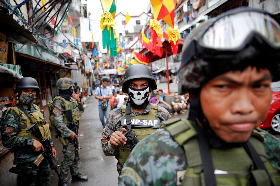 <p>Armed security forces take a part in a drug raid, in Manila, Philippines, Oct. 7, 2016. (Damir Sagolj/Reuters) </p>