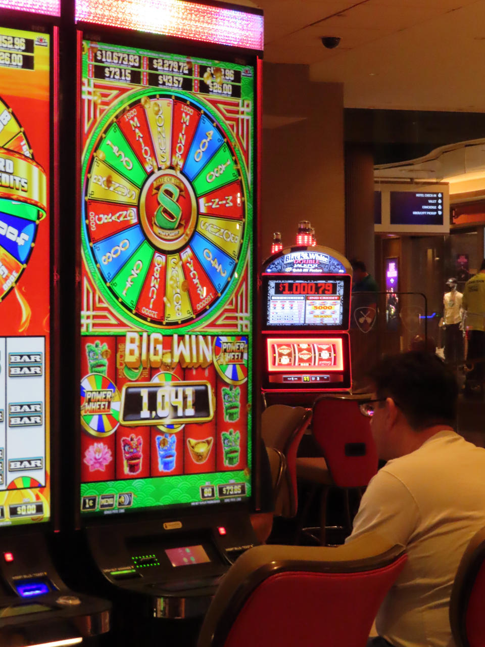 A gambler rings up a win on a slot machine at the Hard Rock casino in Atlantic City, N.J., Aug. 8, 2022. On Oct. 17, 2022, New Jersey gambling regulators reported Atlantic City's casinos won nearly $252 million from in-person gamblers in September, putting them on track to exceed pre-pandemic levels of revenue by the end of the year. (AP Photo/Wayne Parry)