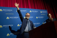 Professor Gregg Semenza, accompanied by Johns Hopkins University President Ron Daniels, waves to the crowd during a news conference after he was awarded the 2019 Nobel Prize in Medicine at Johns Hopkins Medicine Hospital in Baltimore, Md., Monday, Oct. 7, 2019. The 2019 Nobel Prize in Medicine has been jointly awarded to William Kaelin Jr., Sir Peter Ratcliffe and Gregg Semenza for their pioneering research into how human cells respond to changing oxygen levels. (AP Photo/Jose Luis Magana)