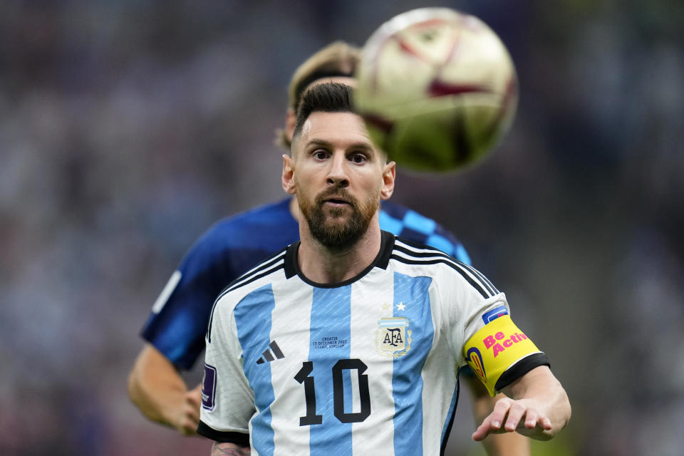 Argentina's Lionel Messi eyes the ball during the World Cup semifinal soccer match between Argentina and Croatia at the Lusail Stadium in Lusail, Qatar, Tuesday, Dec. 13, 2022. (AP Photo/Natacha Pisarenko)