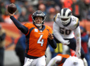 Denver Broncos quarterback Case Keenum (4) throws as Los Angeles Rams linebacker Samson Ebukam (50) pursues during the first half of an NFL football game, Sunday, Oct. 14, 2018, in Denver. (AP Photo/David Zalubowski)