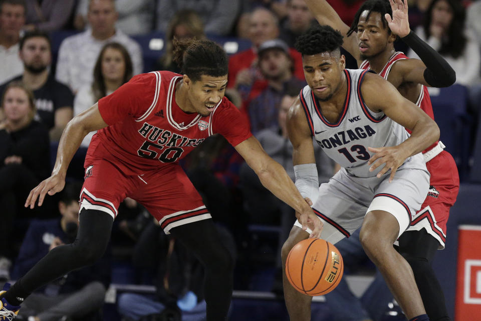 Northern Illinois guard Anthony Crump (50) steals the ball from Gonzaga guard Malachi Smith (13) during the first half of an NCAA college basketball game, Monday, Dec. 12, 2022, in Spokane, Wash. (AP Photo/Young Kwak)