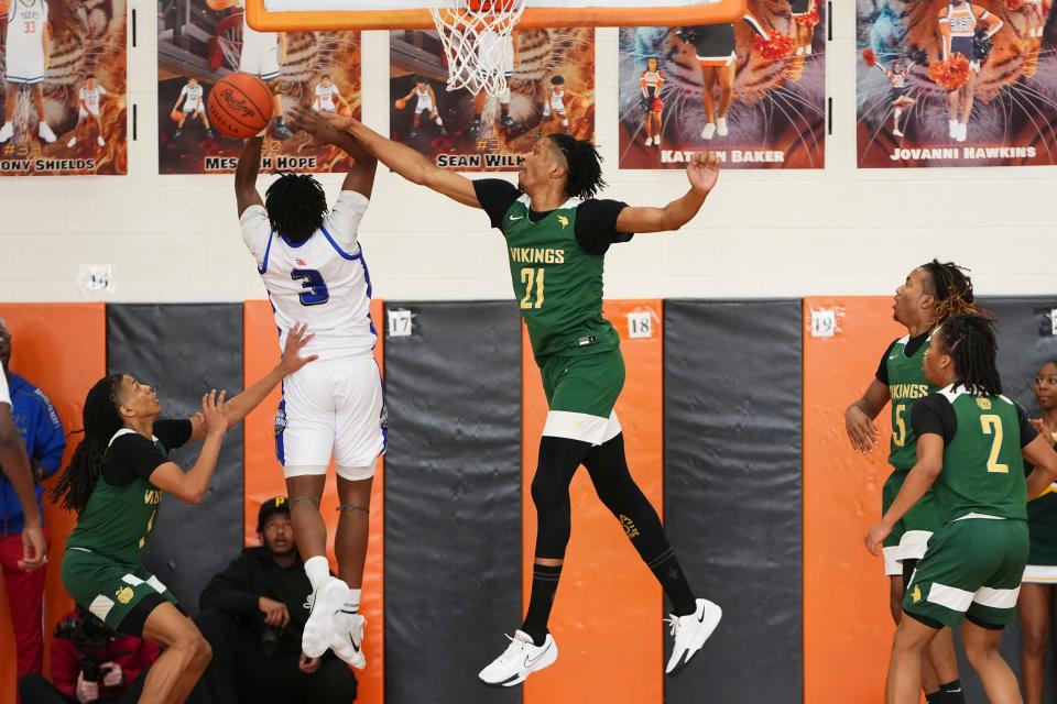 Northland’s Nehemiah McMorris, here defending South’s Carmelo McDonald in the City League championship game Feb. 17 at East, said NIL is a frequent topic of conversation among teammates.