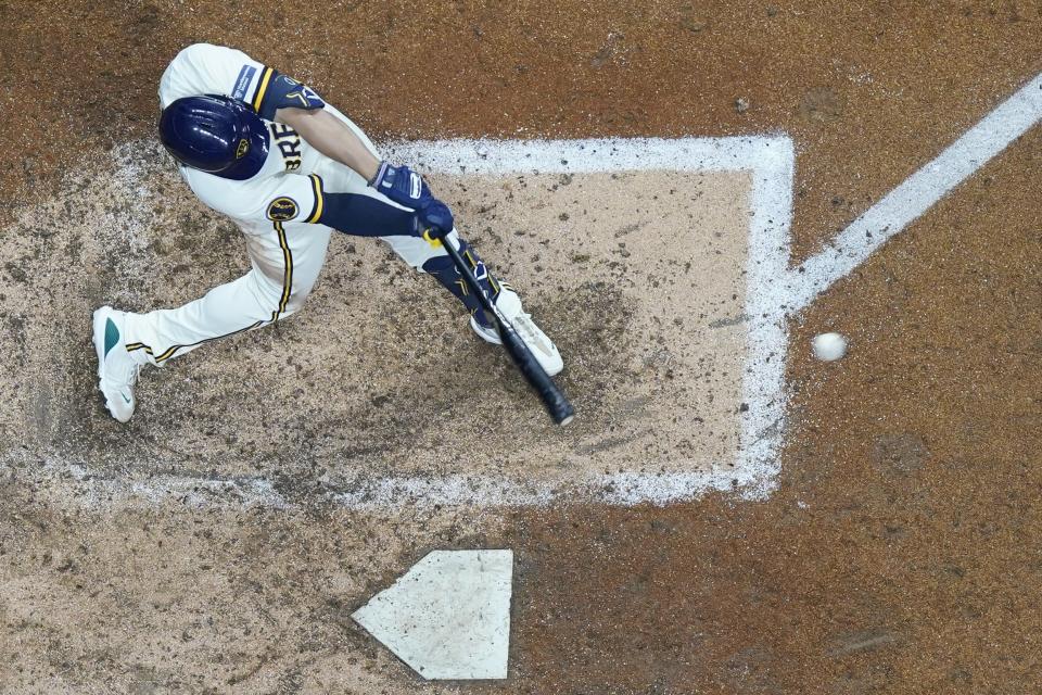 Milwaukee Brewers' Tyrone Taylor hits an RBI double during the seventh inning of a baseball game against the St. Louis Cardinals Wednesday, Sept. 27, 2023, in Milwaukee. (AP Photo/Morry Gash)