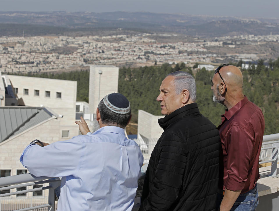 Israeli Prime Minister Benjamin Netanyahu, center, meets with heads of Israeli settlement authorities at the Alon Shvut settlement, in the Gush Etzion block, in the occupied the West Bank, Tuesday, Nov. 19, 2019. (Menahem Kahana/ Pool via AP)