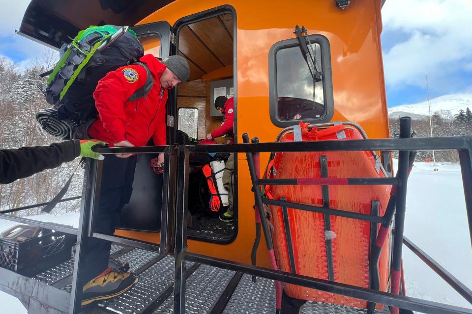 In this image provided New Hampshire Fish and Game, New Hampshire Fish and Game conservation officer Brad Jones prepares to set out on a rescue mission at the Cog Railway base station ,Saturday, Feb. 17, 2024, in Mount Washington, N.H. A team of rescuers used the Cog Railway to shave off time but it still took more than 10 hours to save a hiker in conditions that included sustained winds topping 90 mph (145 kph) on New Hampshire's Mount Washington, officials said. (Sgt. Glen Lucas/New Hampshire Fish and Game via AP)