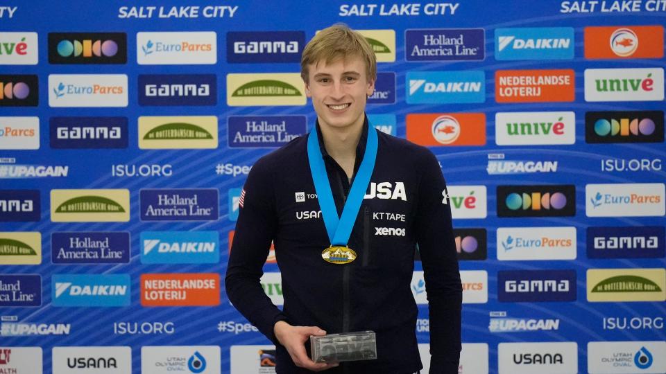 First-place finisher Jordan Stolz celebrates on the podium following the men's 500 meters at the ISU World Cup speedskating event Saturday in Kearns, Utah.