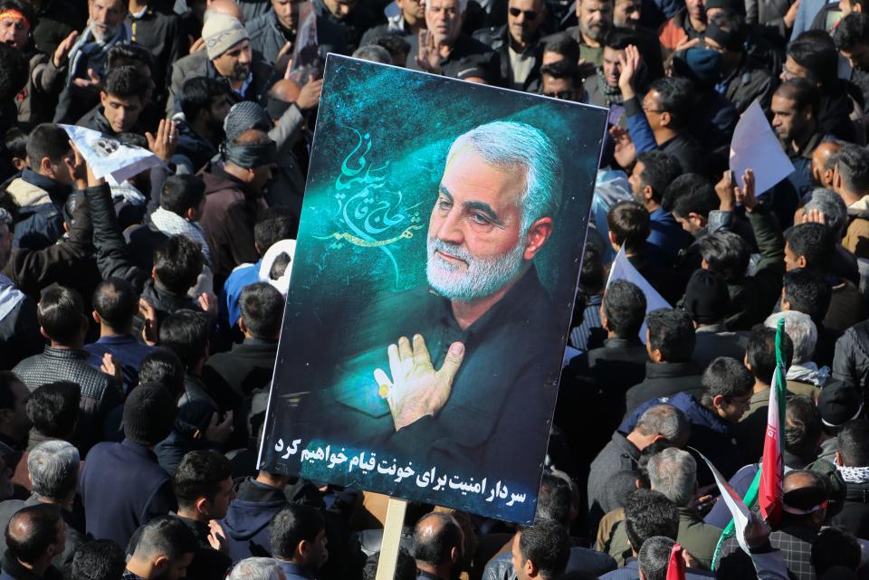 Iranian mourners gather during the final stage of funeral processions for slain top general Qasem Soleimani, in his hometown Kerman on January 7, 2020. - Soleimani was killed outside Baghdad airport on January 3 in a drone strike ordered by US President Donald Trump, ratcheting up tensions with arch-enemy Iran which has vowed "severe revenge". The assassination of the 62-year-old heightened international concern about a new war in the volatile, oil-rich Middle East and rattled financial markets. (Photo by ATTA KENARE / AFP) (Photo by ATTA KENARE/AFP via Getty Images)