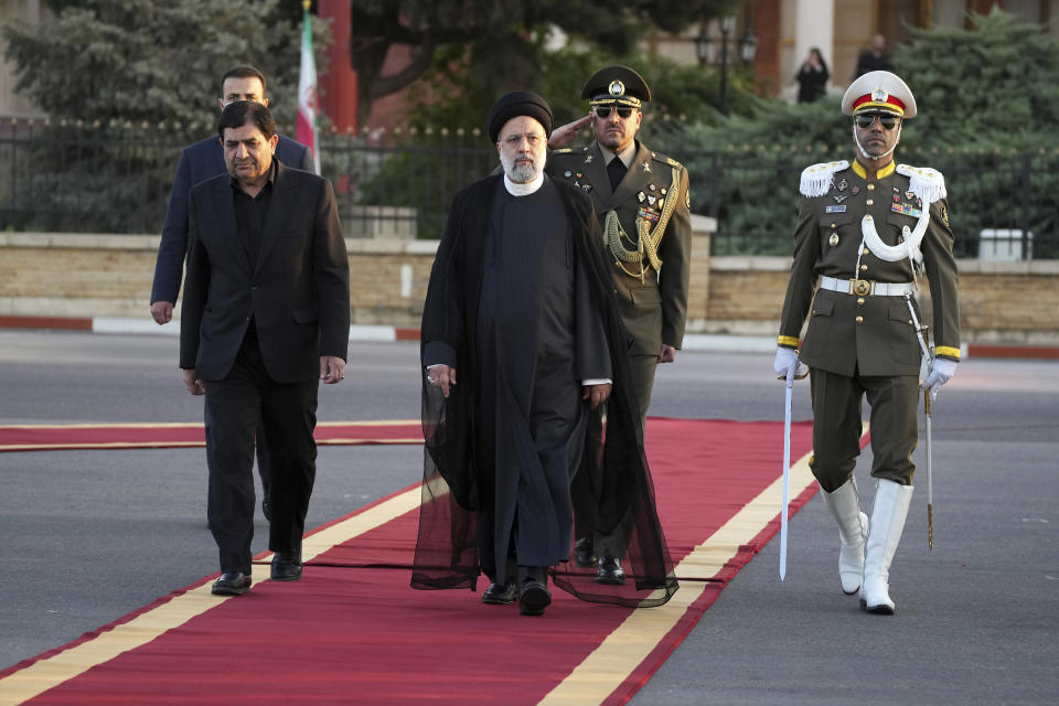 Iranian President Ebrahim Raisi, center, reviews an honor guard during his official departure ceremony as he leaves Tehran's Mehrabad airport to New York to attend annual UN General Assembly meeting, Monday, Sept. 19, 2022. Raisi headed to New York on Monday, where he will be speaking to the U.N. General Assembly later this week, saying that he has no plans to meet with President Joe Biden on the sidelines of the U.N. event. (AP Photo/Vahid Salemi)