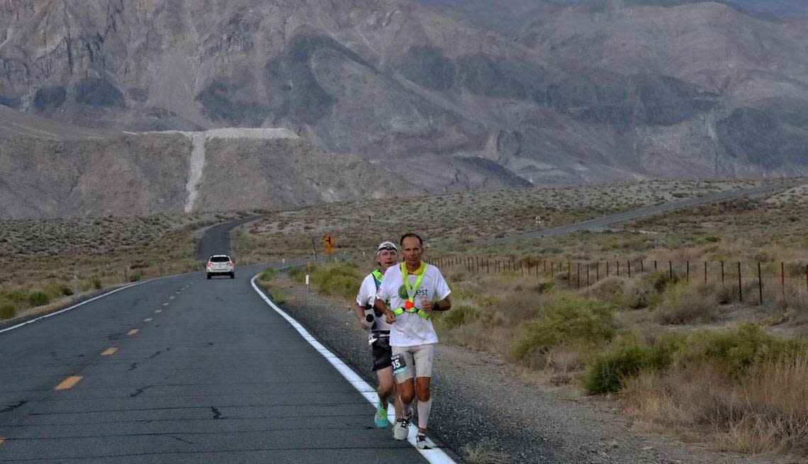 Harvey Lewis of Ohio and his pacer head toward Lone Pine on July 20, 2021. The 45-year-old teacher won his second Badwater 135 in 25 hours, 50 minutes, 23 seconds.