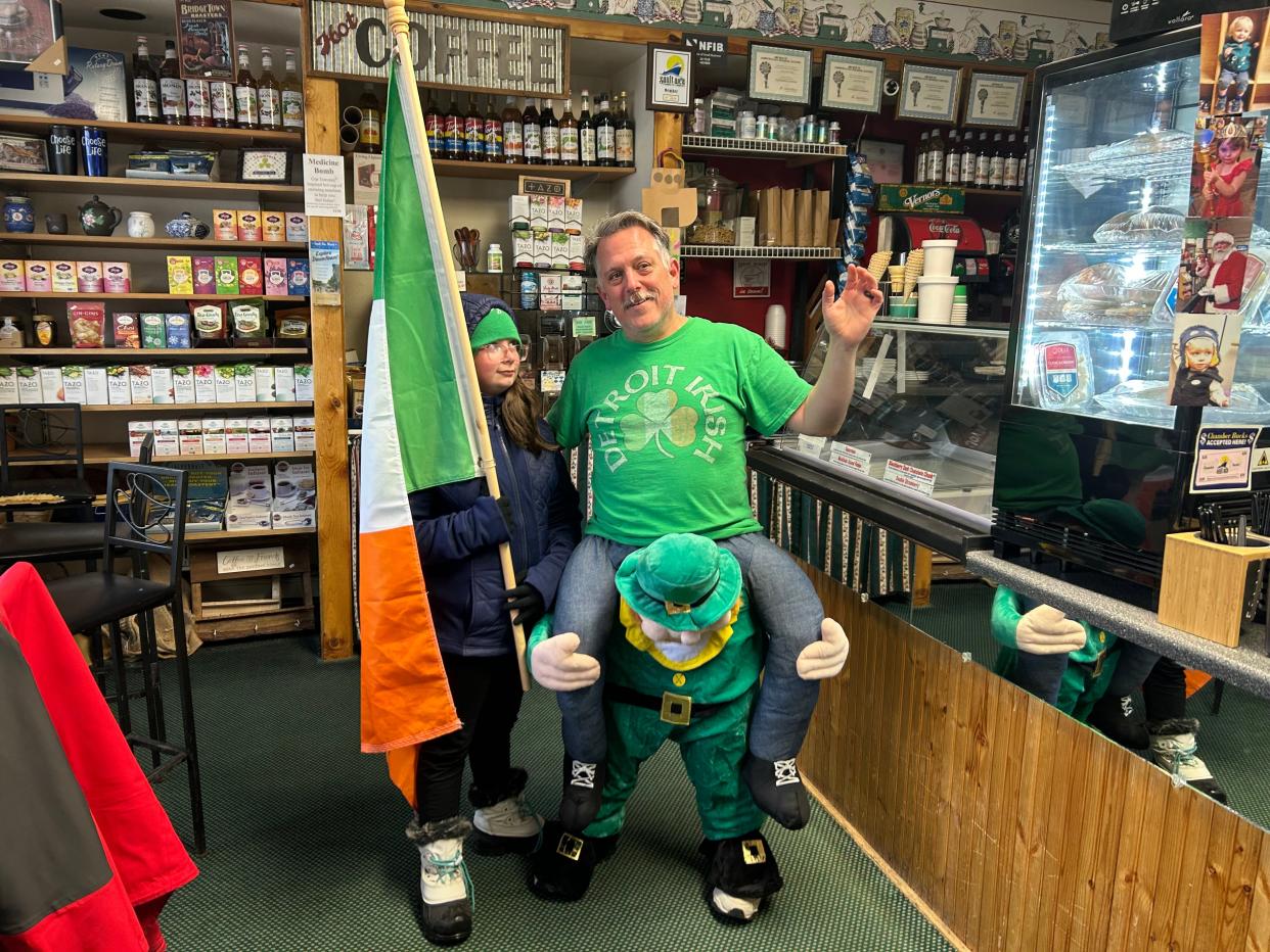 Cup of The Day owner Anthony Stackpoole and his daughter leading the 2023 Sault Ste. Marie St. Paddy's Day parade.