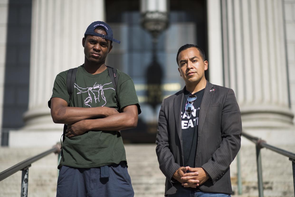 Attorney Cesar Vargas, right, the first openly undocumented attorney in New York, with his client Ivan Ruiz in Manhattan. (Photo: DAMON DAHLEN/HuffPost)