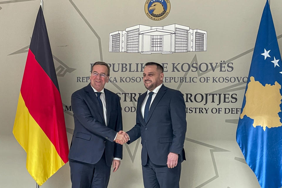 German Defense Minister Boris Pistorius, left, shakes hands with Kosovo's Defense Minister Ejup Maqedonci, in Pristina, Kosovo, Monday, Feb. 5, 2024. (AP Photo/Zenel Zhinipotoku)