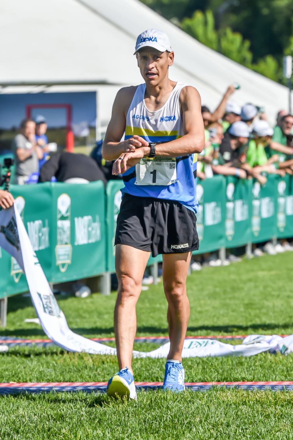 The top male finisher, Sergio Reyes, crosses the finish line at the M&T Bank Vermont City Marathon and Relay on Sunday at Burlington's Waterfront Park.